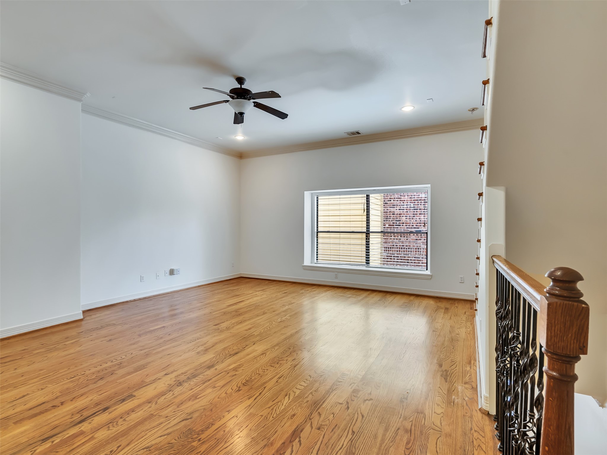 2540 Prospect Street, Unit B Houston, TX 77004 - Photo 29 of 37 wooden floor in an empty room with a window