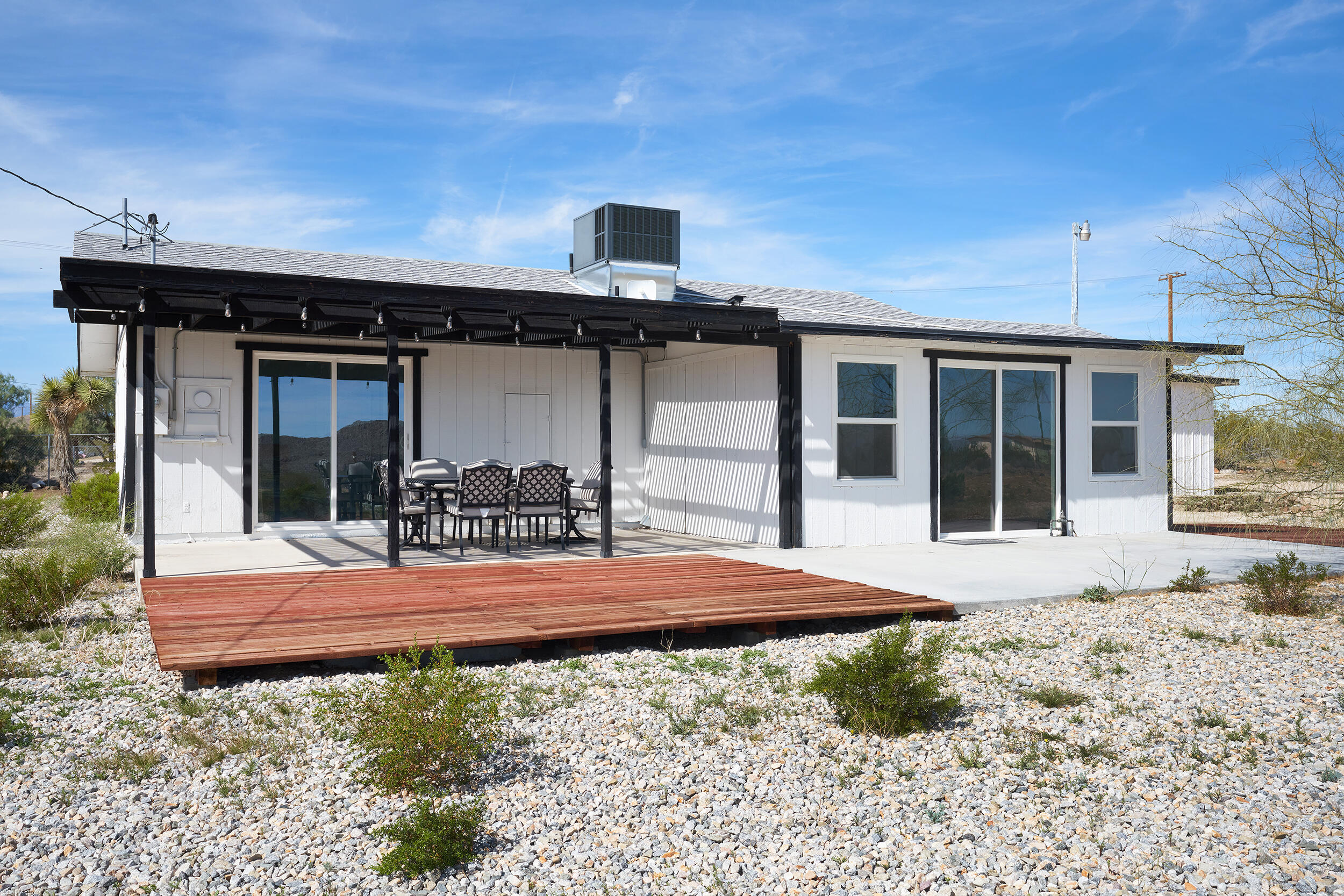 2071 Border Avenue Joshua Tree, CA 92252 - Photo 43 of 50 a house view with a backyard space