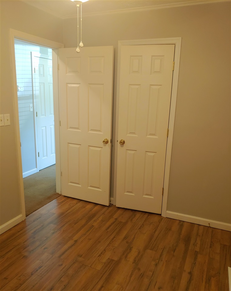 866 Augusta Farms Road Waynesboro, VA 22980 - Photo 20 of 28 an empty room with wooden floor and windows