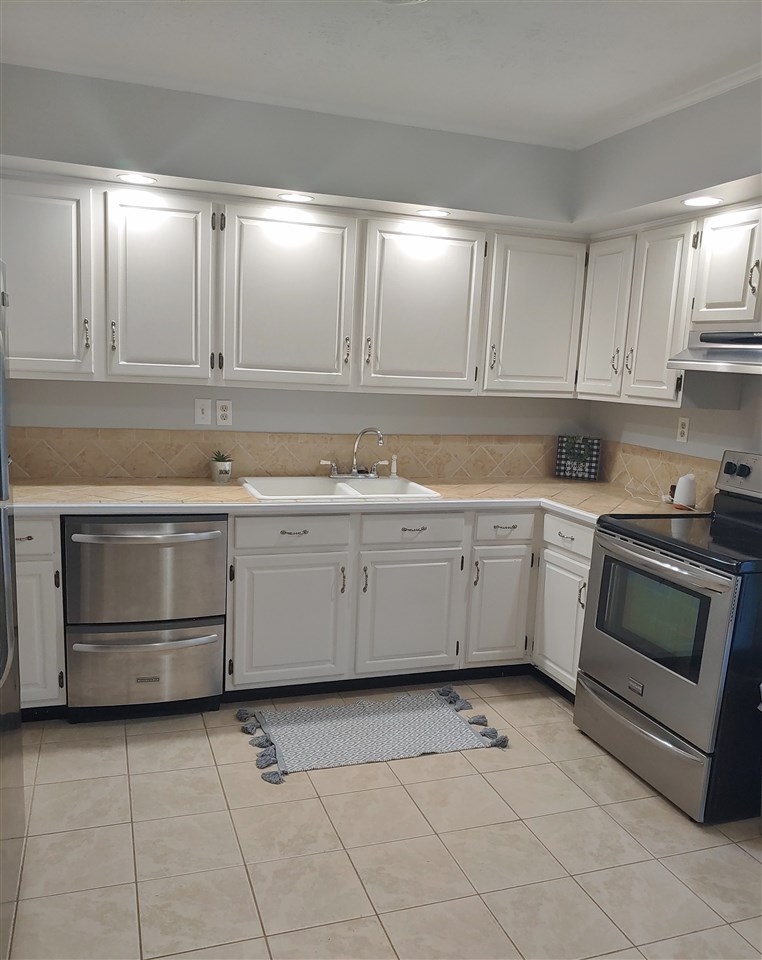 866 Augusta Farms Road Waynesboro, VA 22980 - Photo 6 of 28 a kitchen with a stove sink and cabinets