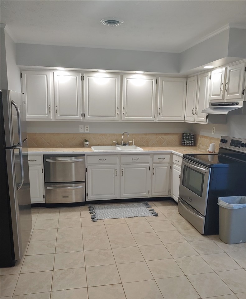 866 Augusta Farms Road Waynesboro, VA 22980 - Photo 7 of 28 a kitchen with a sink a stove and cabinets