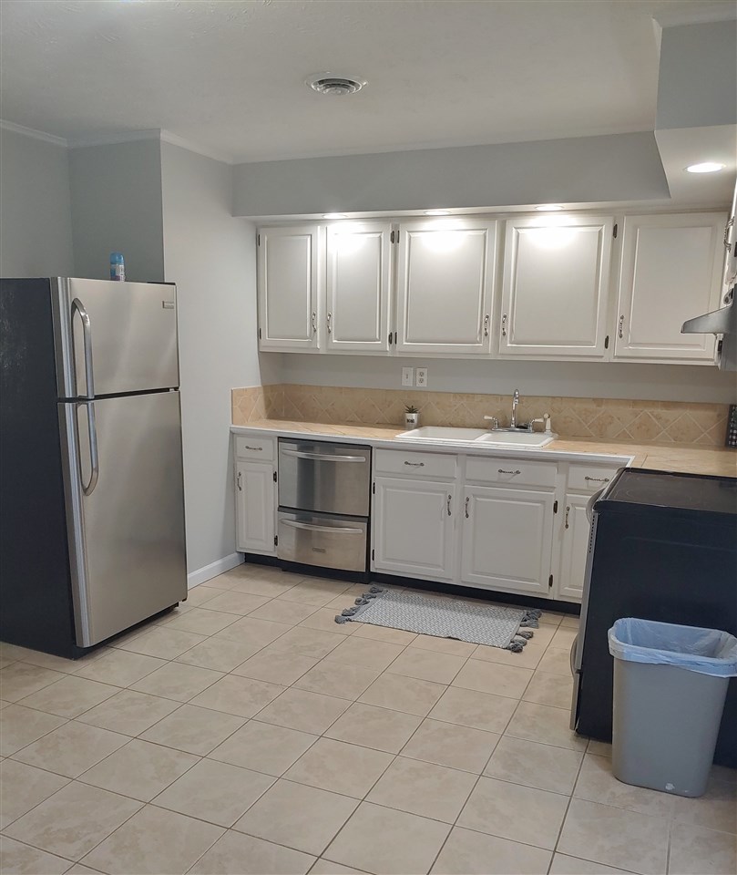 866 Augusta Farms Road Waynesboro, VA 22980 - Photo 8 of 28 a kitchen with a refrigerator sink and cabinets