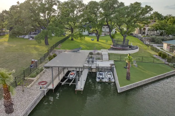 a view of a wooden deck and lake view