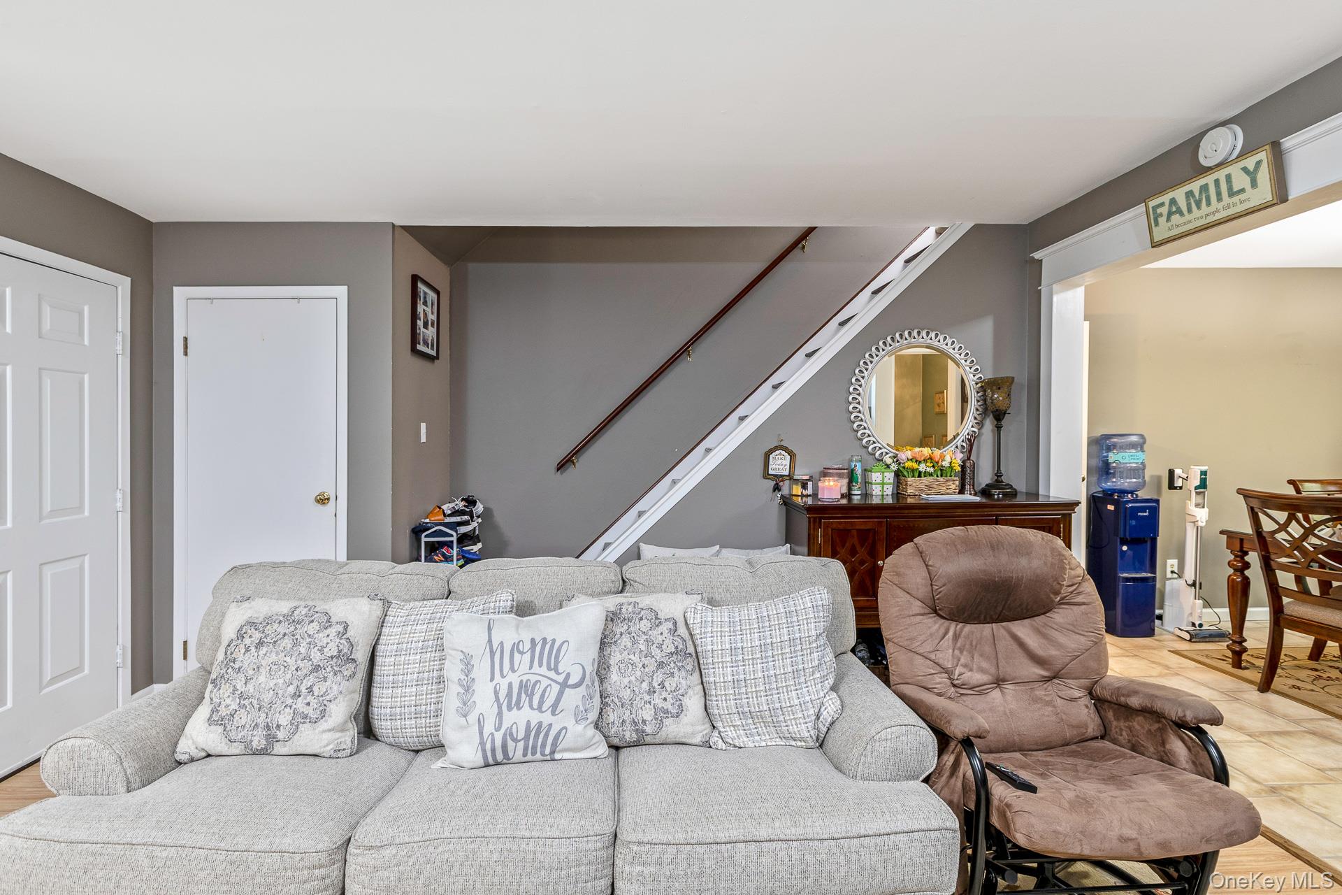 17 Stone Commons Yaphank, NY 11980 - Photo 11 of 31 Living area with neutral gray walls and white trim