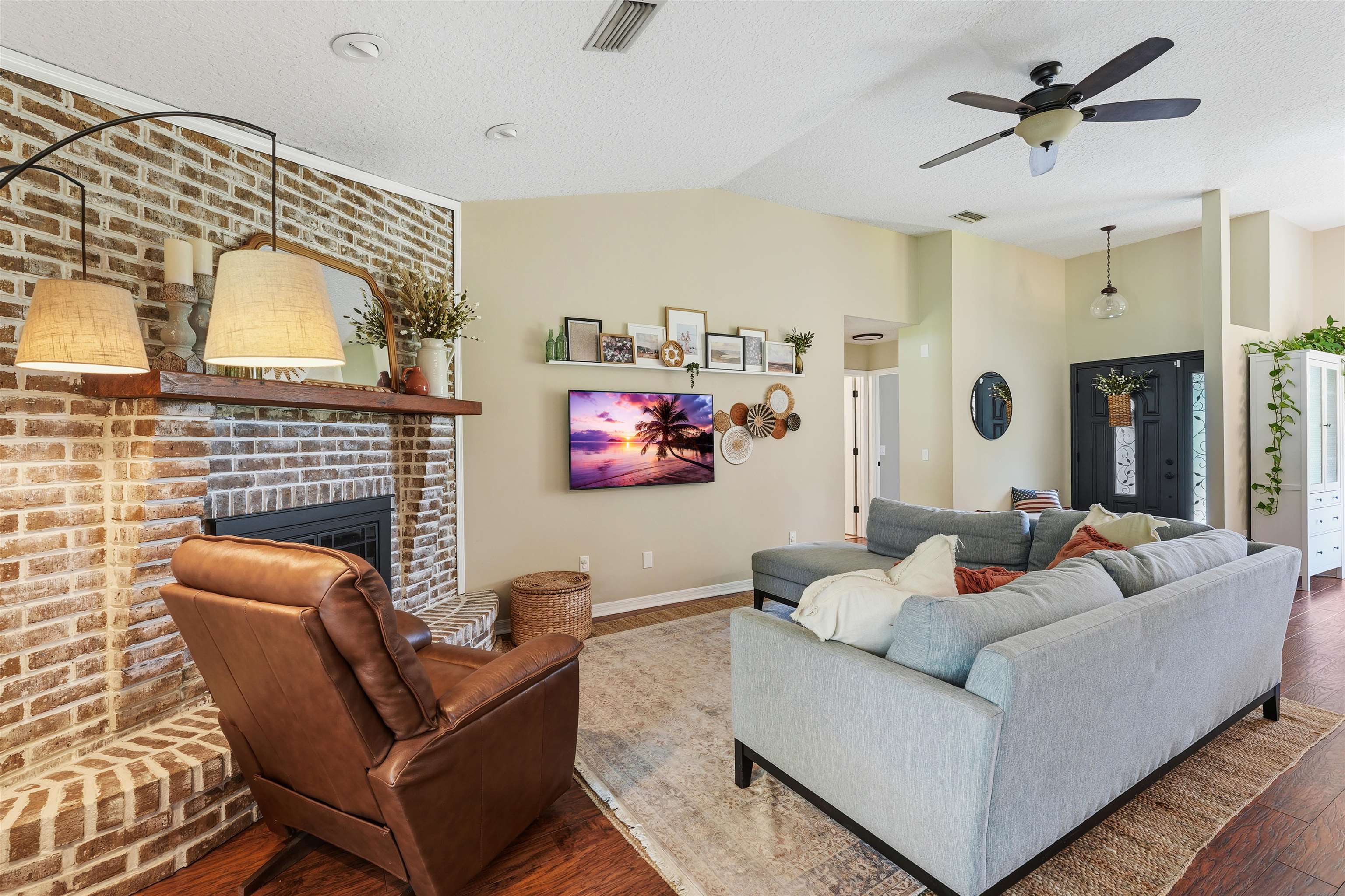 1805 Bennett Road St. Augustine, FL 32092 - Photo 10 of 65 a living room with furniture and a flat screen tv