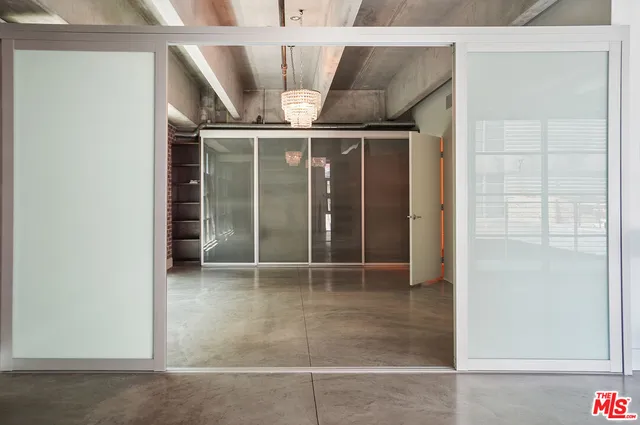 a view of an empty room with a sliding door