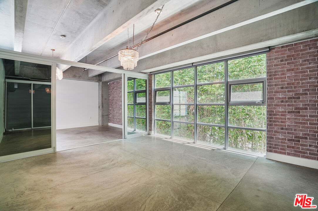 4141 Glencoe Avenue, Unit 211 Marina del Rey, CA 90292 - Photo 13 of 49 a view of an empty room with a sliding door