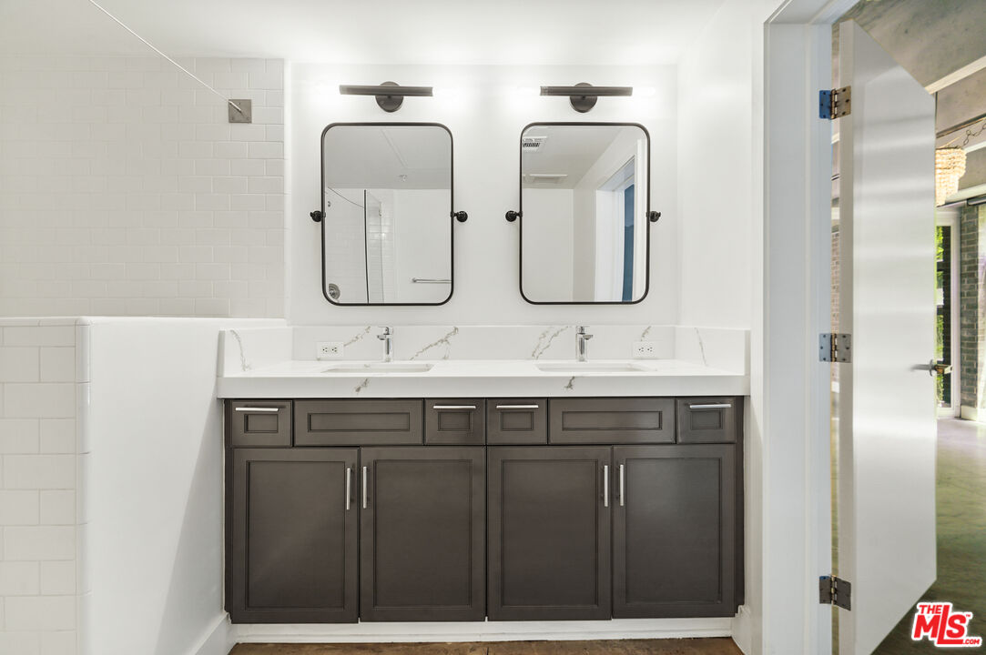 4141 Glencoe Avenue, Unit 211 Marina del Rey, CA 90292 - Photo 16 of 49 a bathroom with double sink and two mirror