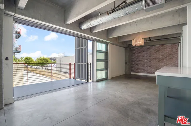 a view of an empty room with windows