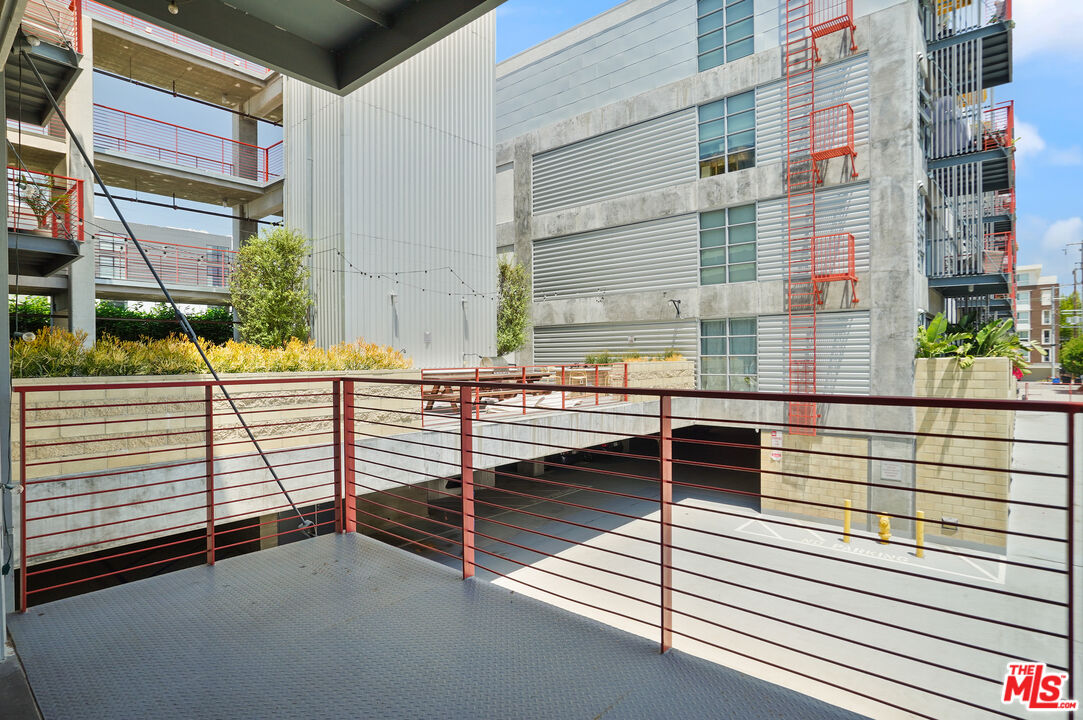 4141 Glencoe Avenue, Unit 211 Marina del Rey, CA 90292 - Photo 22 of 49 a view of a balcony with car parked