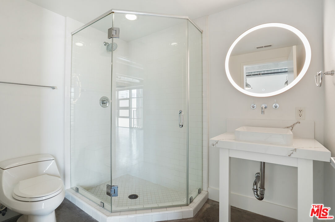 4141 Glencoe Avenue, Unit 211 Marina del Rey, CA 90292 - Photo 24 of 49 a bathroom with a toilet and a sink