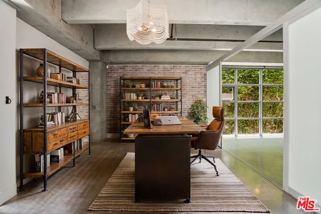 a dining room with furniture a rug and wooden floor