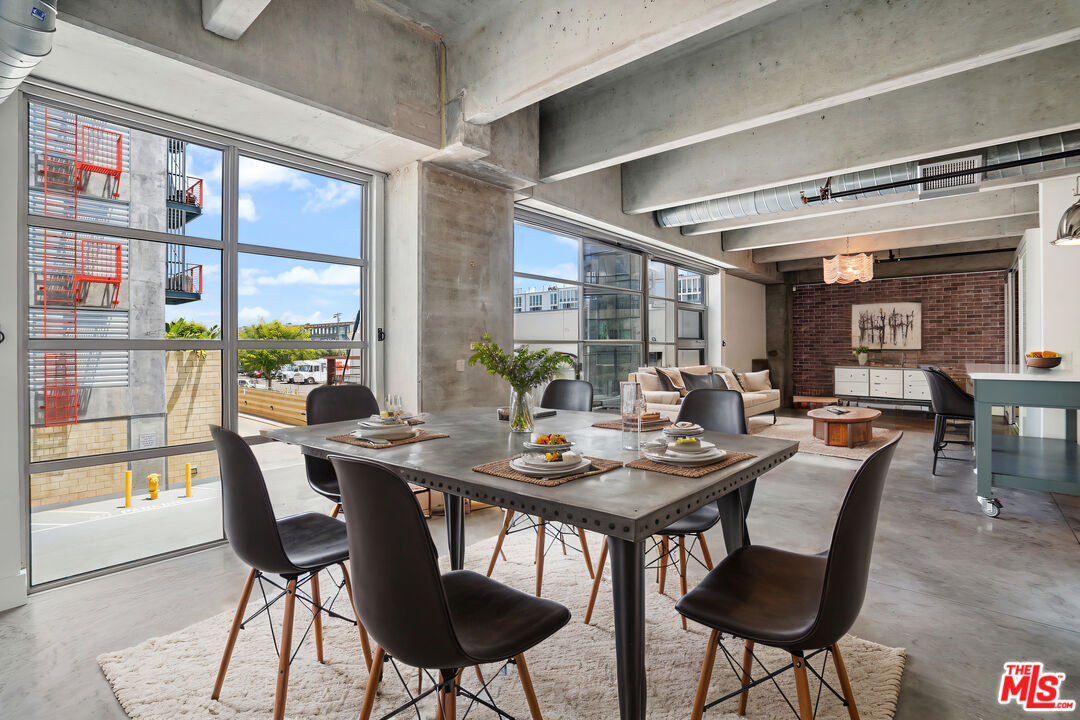4141 Glencoe Avenue, Unit 211 Marina del Rey, CA 90292 - Photo 29 of 49 a dining room with furniture a rug and wooden floor