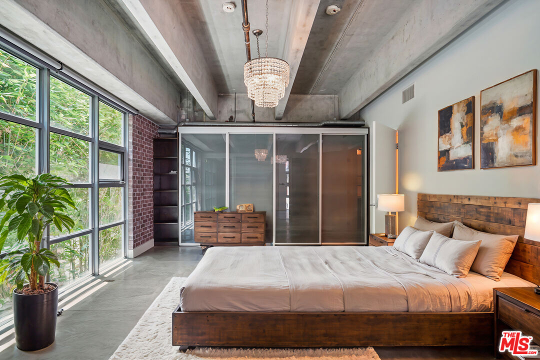 4141 Glencoe Avenue, Unit 211 Marina del Rey, CA 90292 - Photo 30 of 49 a bedroom with a large bed and a large window