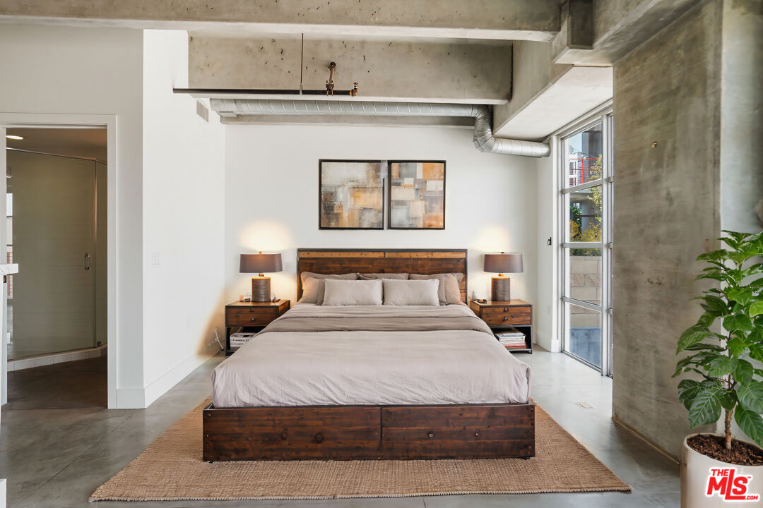 4141 Glencoe Avenue, Unit 211 Marina del Rey, CA 90292 - Photo 31 of 49 a large white bed in a small room