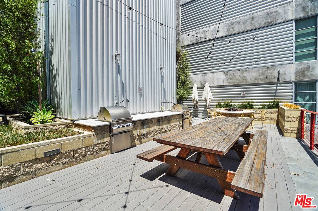 4141 Glencoe Avenue, Unit 211 Marina del Rey, CA 90292 - Photo 35 of 49 a terrace with outdoor seating and wooden floor