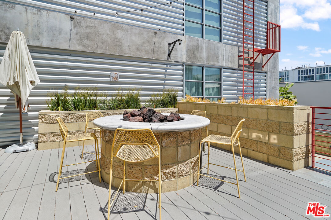 4141 Glencoe Avenue, Unit 211 Marina del Rey, CA 90292 - Photo 37 of 49 a view of a dining room with furniture and wooden floor
