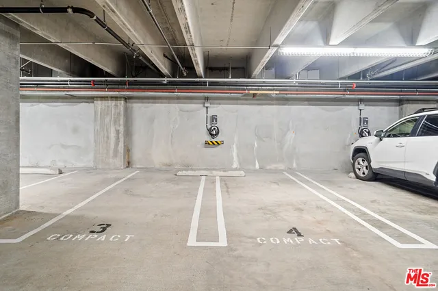 a front view of a building with glass windows and shower