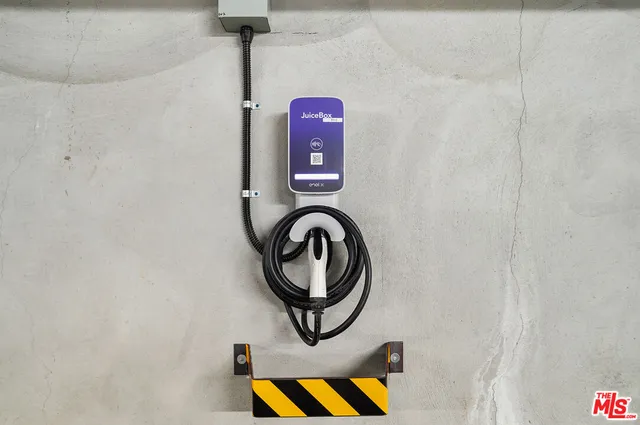 a view of a porch with chairs and potted plants