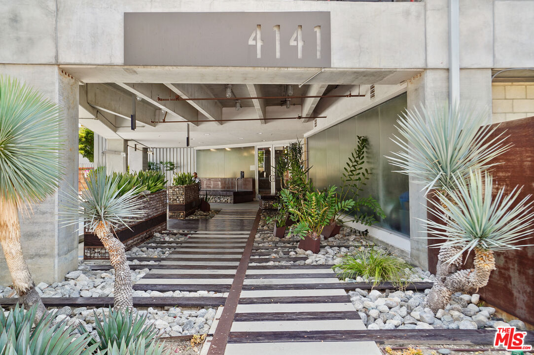 4141 Glencoe Avenue, Unit 211 Marina del Rey, CA 90292 - Photo 45 of 49 a view of a porch with chairs and potted plants