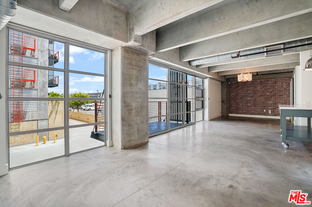 4141 Glencoe Avenue, Unit 211 Marina del Rey, CA 90292 - Photo 7 of 49 a view of an empty room with a balcony