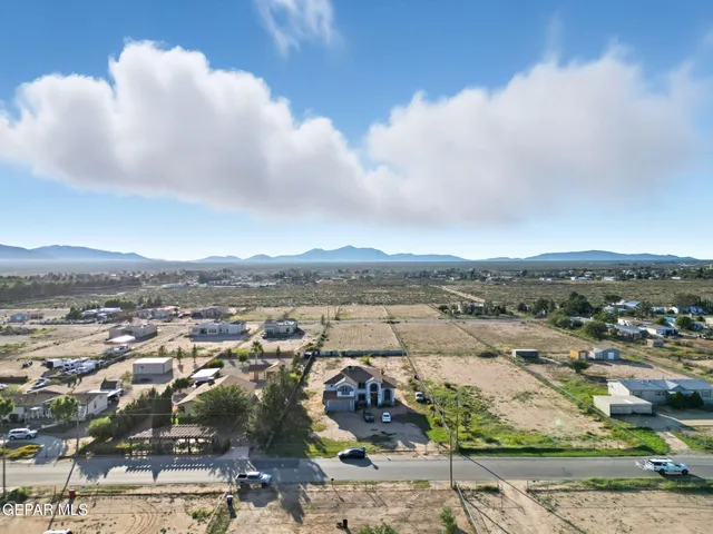 an aerial view of residential building and ocean