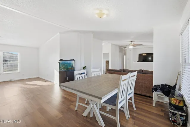 a view of a dining room with furniture window and wooden floor