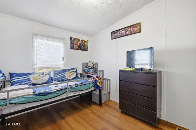 a room with a bed and furniture