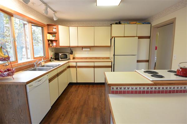 400 South Meadow Road Lancaster, MA 01523 - Photo 5 of 20 a kitchen with a sink stove and refrigerator