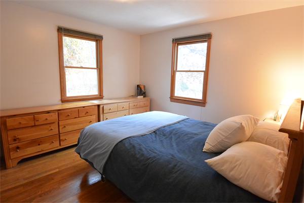 400 South Meadow Road Lancaster, MA 01523 - Photo 8 of 20 a bedroom with a bed and window
