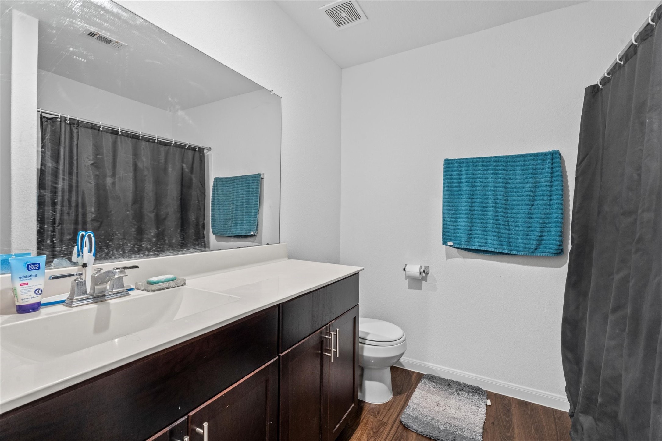 5826 Finely Run St Spring Spring, TX 77373 - Photo 23 of 38 a bathroom with a sink a toilet a mirror and shower