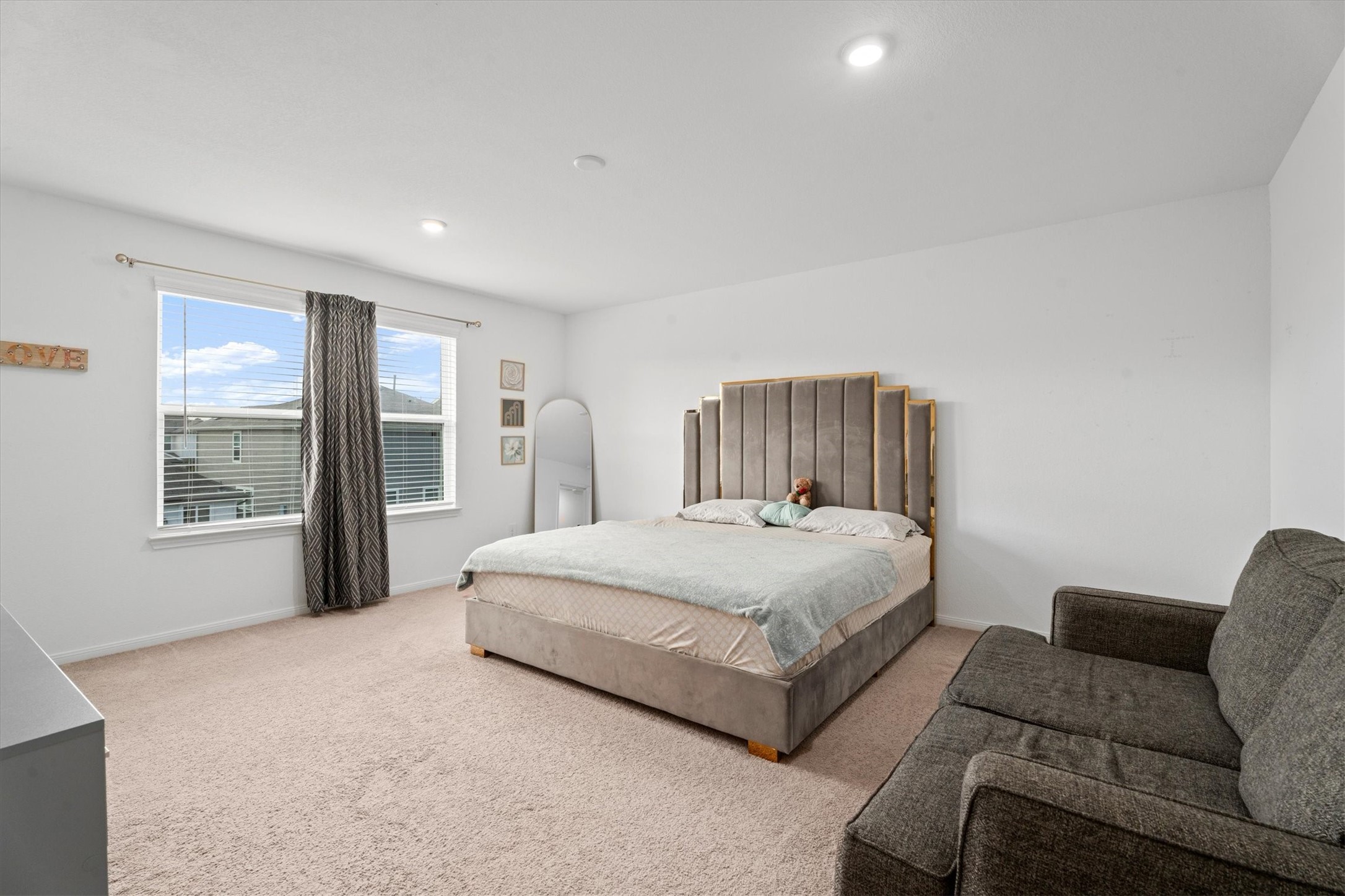 5826 Finely Run St Spring Spring, TX 77373 - Photo 26 of 38 a spacious bedroom with a bed and glass window
