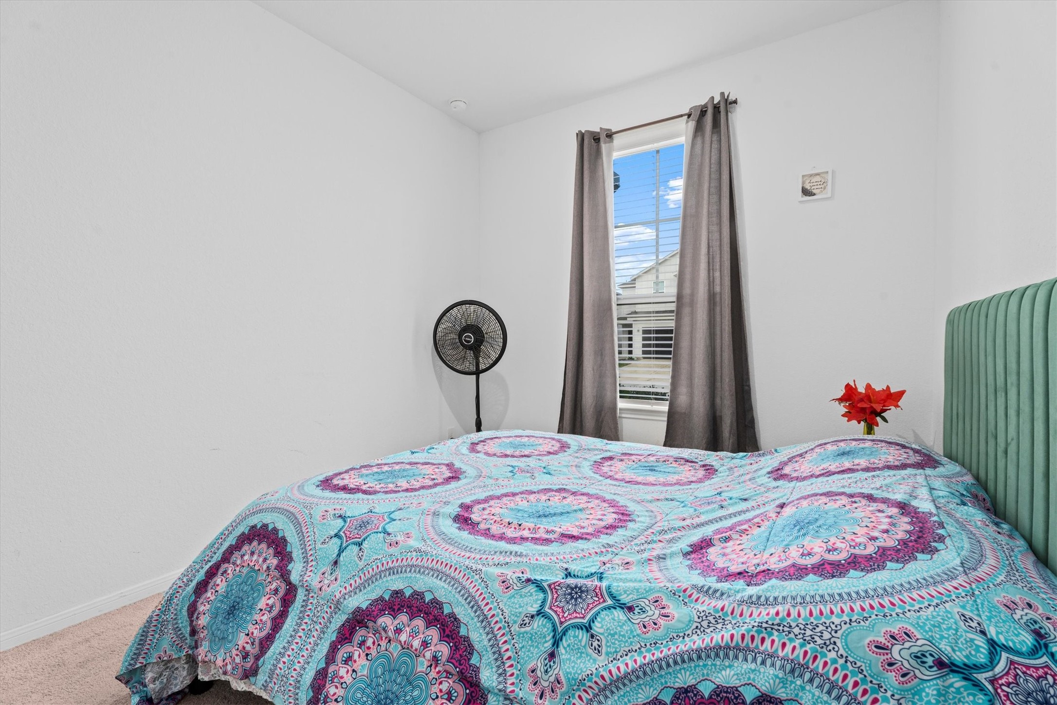 5826 Finely Run St Spring Spring, TX 77373 - Photo 7 of 38 a bedroom with a bed and a chandelier