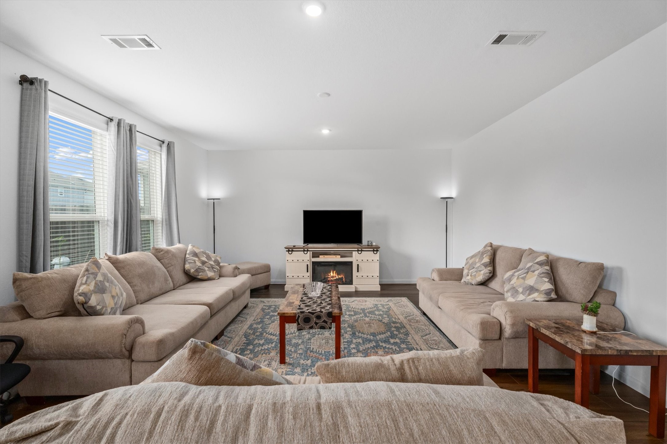 5826 Finely Run St Spring Spring, TX 77373 - Photo 10 of 38 a living room with furniture and a flat screen tv