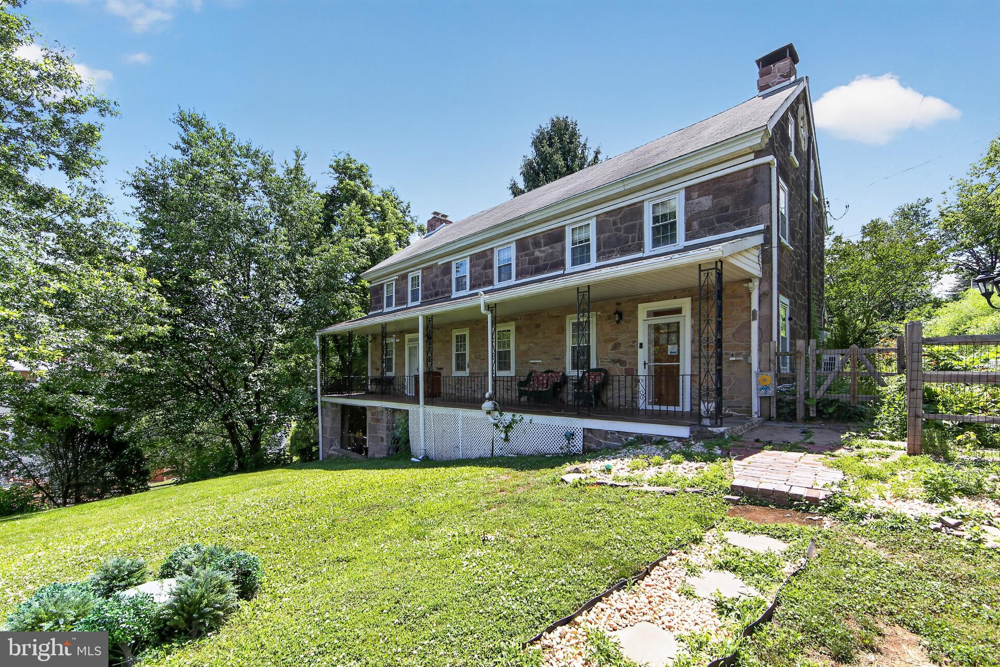 238 Brown Street Spring City, PA 19475 - Photo 2 of 57 Charming historic home with lush greenery.