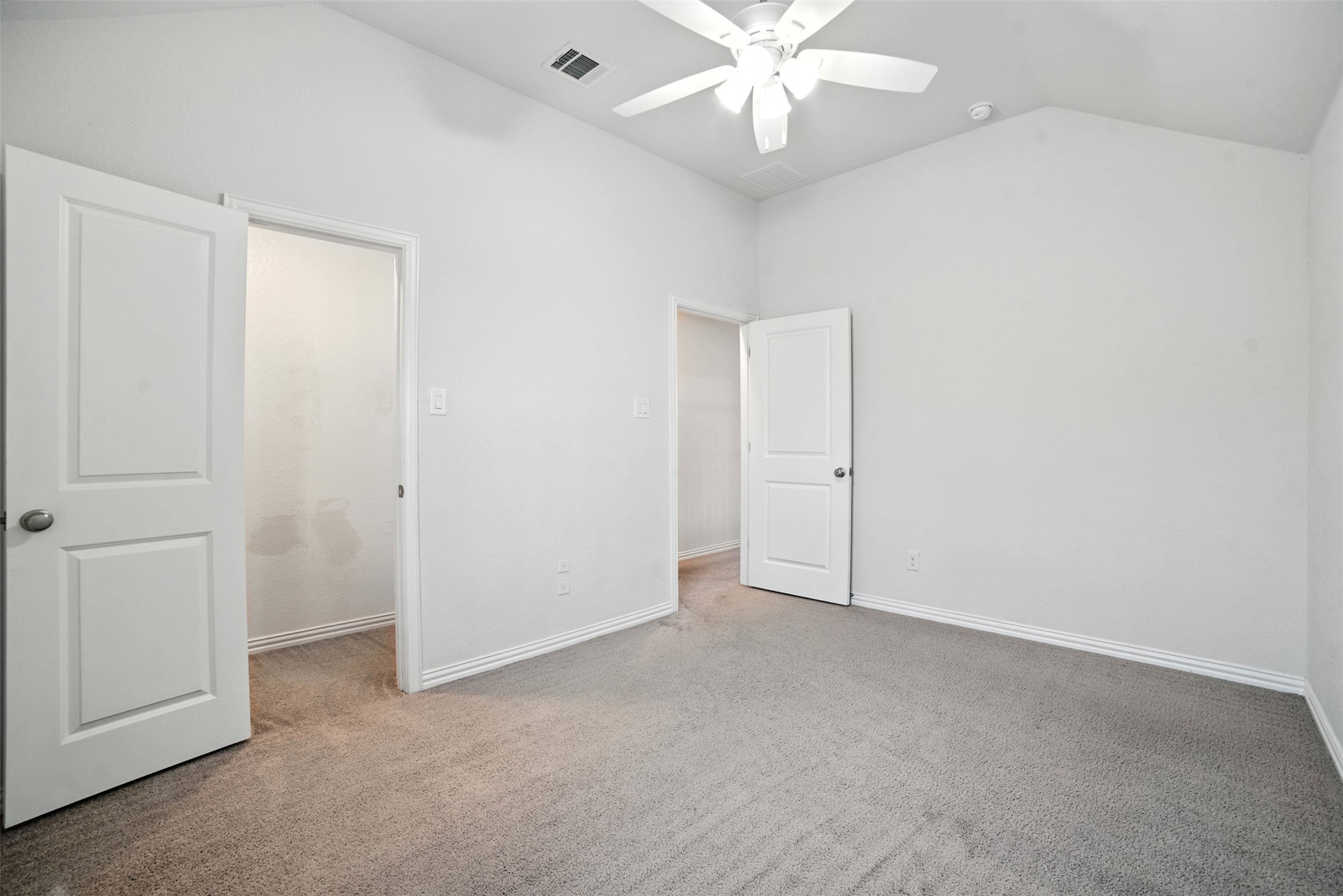 3054 Columbus Loop Round Rock, TX 78665 - Photo 25 of 40 Unfurnished bedroom featuring vaulted ceiling, carpet floors, and a ceiling fan