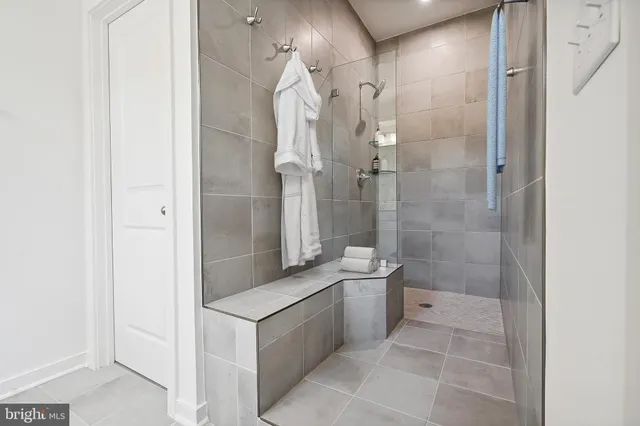 a bathroom with a toilet sink and shower