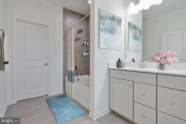 a bathroom with a sink and mirror