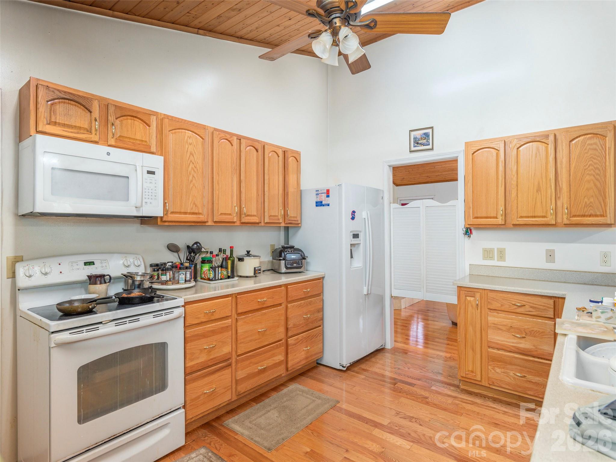 1120 Jacobs Branch Road Franklin, NC 28734 - Photo 13 of 36 a kitchen with stainless steel appliances granite countertop a stove a sink and a refrigerator