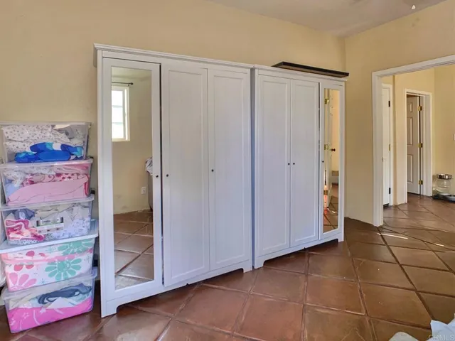 a bed room with a bed and a television