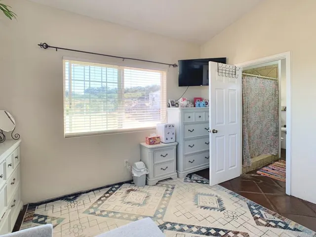 a bathroom with a double vanity sink a mirror and a shower