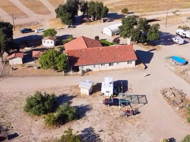 a living room with furniture and a clock