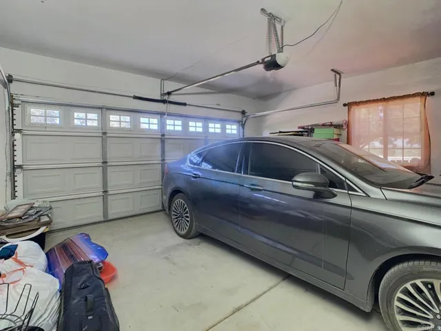 a view of a porch with a table and chairs