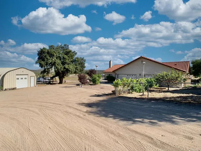 a view of a yard with patio