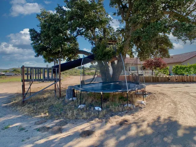 an aerial view of a houses with yard