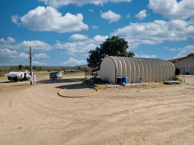 a view of a backyard of a house