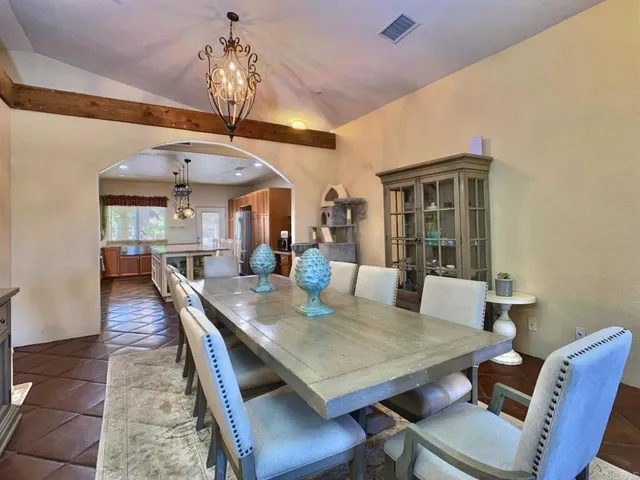 a kitchen with stainless steel appliances a stove a sink dishwasher and a refrigerator