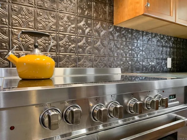 a view of a hallway with closet and wooden floor