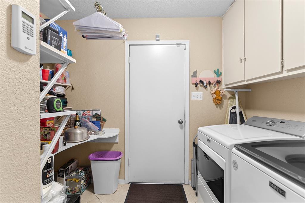 3824 Sugar Ridge Road Fort Worth, TX 76133 - Photo 27 of 29 There's space to add a deep freeze in the laundry room.