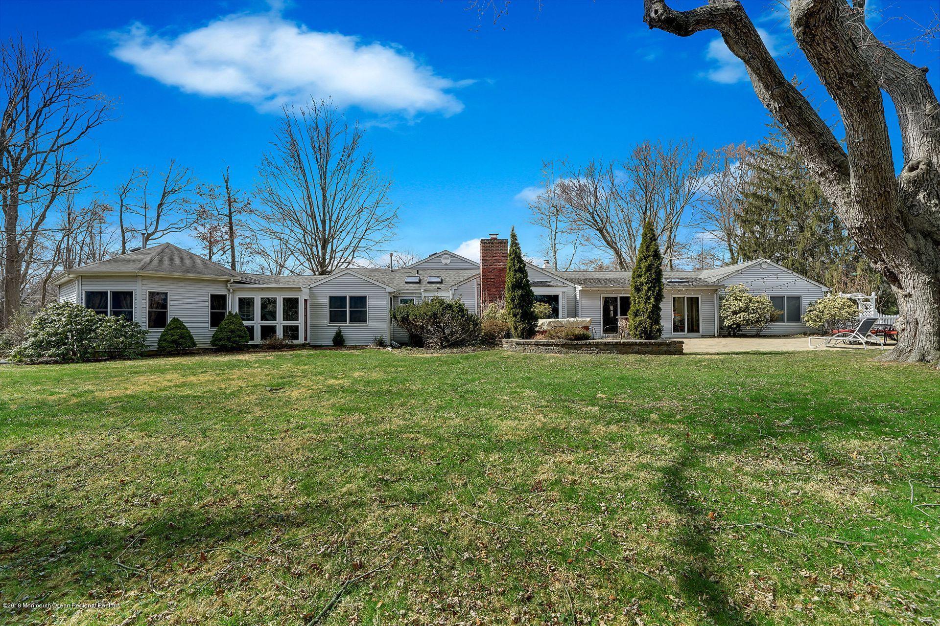 11 Heathcliff Road Rumson, NJ 07760 - Photo 29 of 31 a front view of a house with a yard